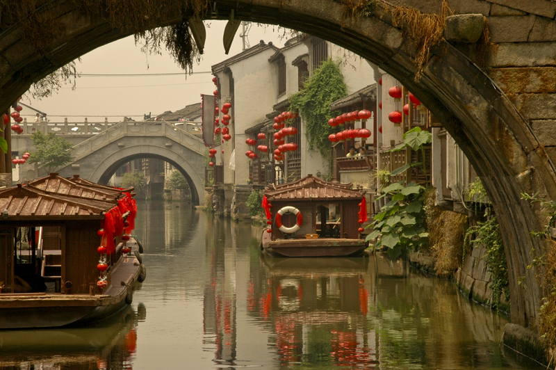 Suzhou ancient bridge with canal boats